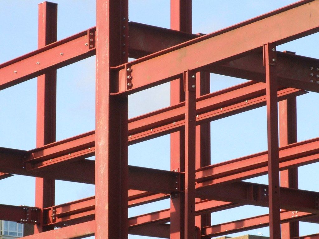 Primed structural steel beams and columns of a building frame